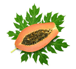 Half of papaya on leaf.