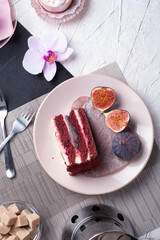 life style set at meeting in cafe.Thai blue, Butterfly pea tea served with fresh figs and panna cotta cake and fruit piece of cake on serving napkins.