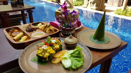 Famous traditional Cambodian Khmer delicacy, the Amok Fish. Vegetables and soya sauce.