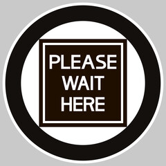 Please wait here.
Round information sign with text content, black and white.