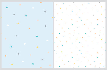 Cute Hand Drawn Abstract Irregular Polka Dots Vector Pattern Set. Colorful Tiny Brush Dots Isolated on a Pastel Blue and White Background. Simple Bright Dotted Vector Print. 