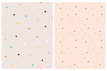 Cute Hand Drawn Abstract Irregular Polka Dots Vector Pattern Set. Colorful Tiny Brush Dots Isolated on a Salmon Pink Background. Simple Bright Dotted Vector Print.  © Magdalena