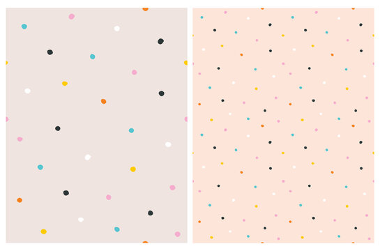 Fototapeta Cute Hand Drawn Abstract Irregular Polka Dots Vector Pattern Set. Colorful Tiny Brush Dots Isolated on a Salmon Pink Background. Simple Bright Dotted Vector Print. 