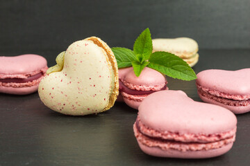heart shaped macaroons  in pink and pale yellow with mint