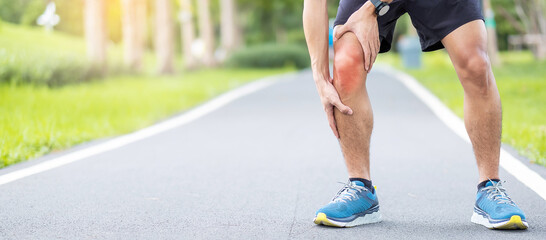 Young adult male with muscle pain during running. runner have knee ache due to Runners Knee or Patellofemoral Pain Syndrome, osteoarthritis and Patellar Tendinitis. Sports injuries and medical concept