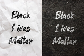 Black lives matter texts on white crumpled paper and black grunge background. Anti-racist slogan design.