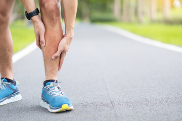 Young adult male with his muscle pain during running. runner man having leg ache due to Shin Splints. Sports injuries and medical concept - obrazy, fototapety, plakaty