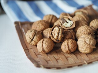 Walnut , the high nutrition nut value for brain on wooden background with copy space , edible seed of a drupe, the genus  Juglans regia (Family Juglandaceae) , benefit help lower Cholesterol