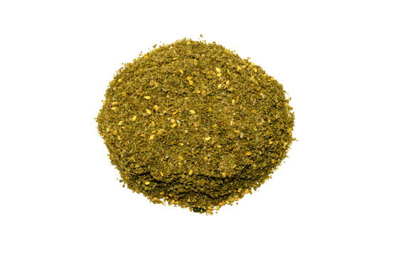 Original Israel and Arabic Za'atar spice isolated on white background. Pile of Middle eastern traditional spice mixture zaatar. Top view