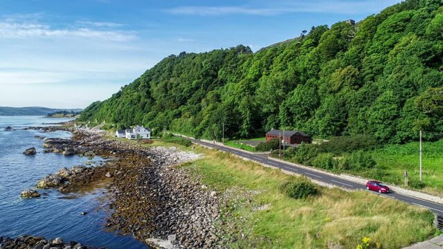 Atlantic coast, Northern Ireland. Garron Point. Geological formation, parking and marina at Antrim Coast Road, a.k.a. Causeway Coastal Route. One of the most scenic coastal roads in Europe. Aerial.