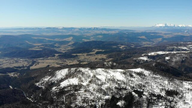 View of High Tatras from top of Jaworzyna Krynicka Mountain in winter