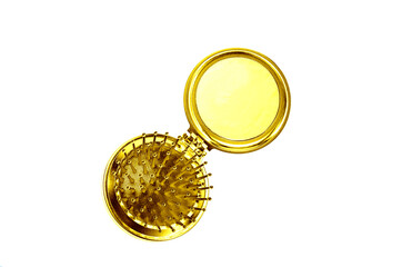 Mini golden mirror-comb isolated on white background