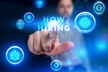 Business, Technology, Internet and network concept. Young businessman working on a virtual screen of the future and sees the inscription: Now hiring