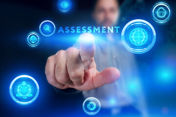 Business, Technology, Internet and network concept. Young businessman working on a virtual screen of the future and sees the inscription: Assessment