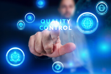 Business, Technology, Internet and network concept. Young businessman working on a virtual screen of the future and sees the inscription: Quality control