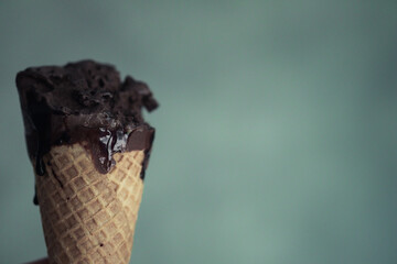 Bite of ice cream chocolate wafer in hand.