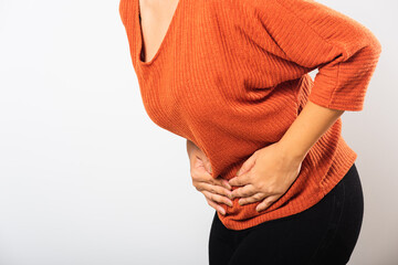 Asian woman she sick have stomach ache holds hands on abdomen, part of body, female having painful stomachache she abdomen bloating or chronic gastritis, studio shot isolated on white background