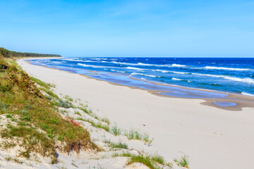 Beautiful white sand beach and blue sea near Kolobrzeg, Baltic Sea coast, Poland