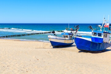 Naklejka na ściany i meble Fishing boats on sandy beach in Chlopy village port, Baltic Sea coast, Poland