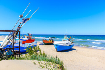 Fishing boats on sandy beach in Chlopy village port, Baltic Sea coast, Poland