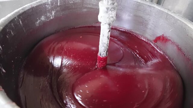 knead red mass for marshmallow or jam. confectionery factory sweets production