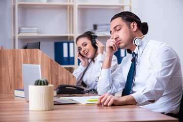 Call center operators working in the office