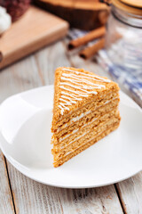 Closeup on sweet dessert slice of honey cake