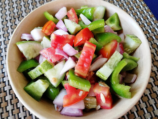 Vegetable mix salad on a plate. Delicious and healthy dish. Concept of dietary nutrition and healthy food