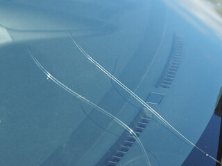 Crack on the car windscreen from a stone close-up.