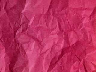 The texture of crumpled paper is maroon. top view
