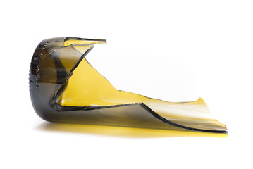 Shattered wine bottle. Parts of the broken bottle glass isolated on white background. Pieces of sharp broken glass. Concept of danger.