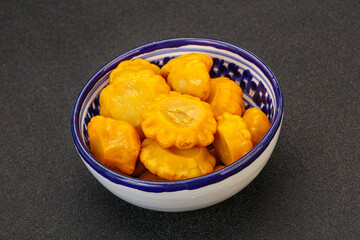 Marinated yellow patisson in the bowl