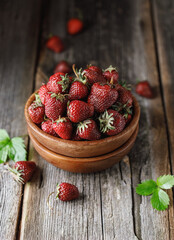 Fresh juicy strawberry on wooden table. Strawberry background