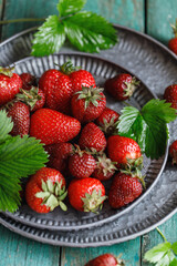 Fresh juicy strawberry on wooden table. Strawberry background
