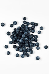 nature and healthy food concept - fresh blueberries isolated on white background
