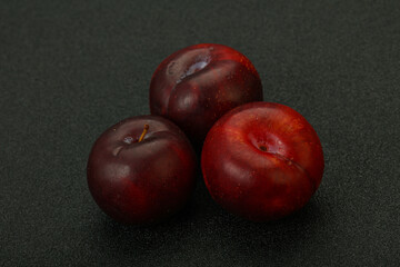 Ripe sweet plum fruit heap
