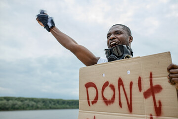 Activist holding cardboard sign