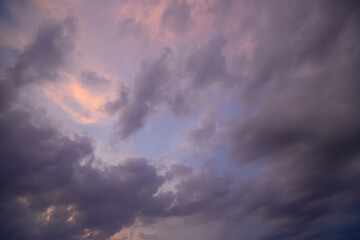 Naklejka na ściany i meble blue sky covered with gray clouds. After the rain. cloudy sky background