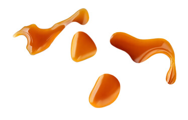 Sweet caramel sauce drops isolated on white background, top view