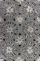 Crafts in white thread, manual elaboration process with sewing needle