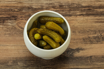 Pickled gherkin in the bowl