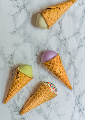 different ice cream cones on white background