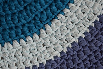 Round rug made of handmade knitted yarn.Crocheting.It will add warmth and comfort to the interior...