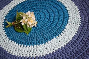 Round rug made of handmade knitted yarn.Crocheting.It will add warmth and comfort to the interior...