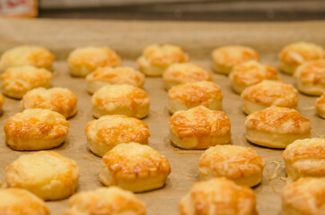 baked cheese scones on a baking sheet