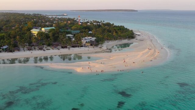 Kota beach Bantayan Island Philippines with turquoise colored ocean waters, Dolly in reveal shot