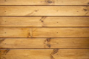 Fototapeta premium Wooden boards as a background. The wall of a wooden house