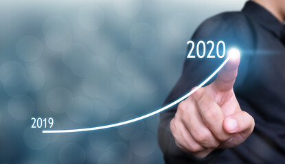 businessman drawing graph in growth 2020 concept , business growth concept , finance concept