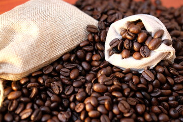 close up coffee beans and macro coffee beans on wood table background