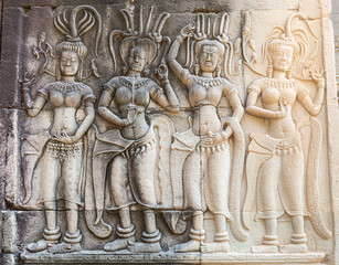 Old and new (restored) wall carvings at Angkor Wat